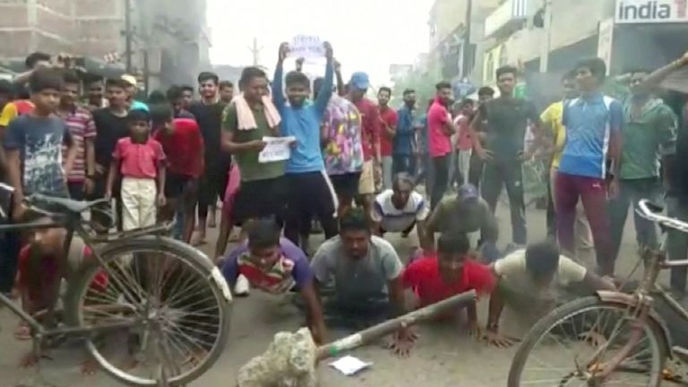 Protesters do push-ups as they protest "Agnipath Schema" to recruit personnel for the armed forces, in Munger, Bihar, India June 16, 2022 in this still image obtained from a handout video.  ANI/Materials broadcast via REUTERS THIS IMAGE HAS BEEN PROVIDED BY THIRD PARTY.  CREDIT MANDATORY.  NO ANSWER.  NO STOCK.  INDIA OUT.  NO COMMERCIAL SALES OR EDITING IN INDIA.