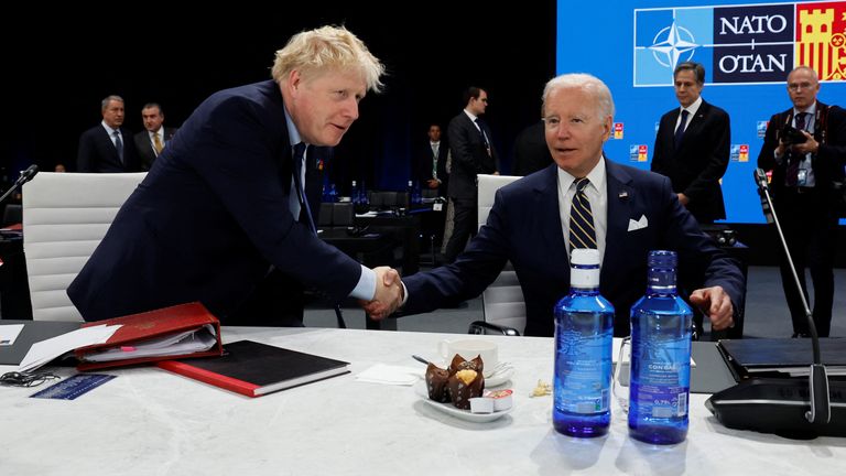 t Joe Biden and British Prime Minister Boris Johnson talk during the Meeting of the North Atlantic Council Session with fellow heads of state at the NATO summit at the IFEMA arena in Madrid