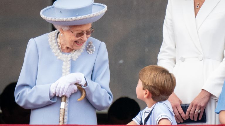 Queen Elizabeth II speaks to Prince Louis on the balcony of Buckingham Palace, as they watch the Platinum Jubilee flypast, on day one of the Platinum Jubilee celebrations. Picture date: Thursday June 2, 2022.
