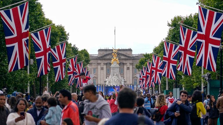 People walk along The Mall in London, Wednesday, June 1, 2022, as they camp out ahead of the start of the Queen&#39;s Jubilee  