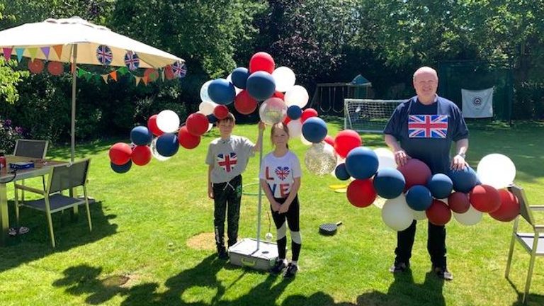 Mhairi Macdonald's twins Georgia and James, 8, below up 70 jubilee balloons in Edinburgh with their Dad on hand to help
