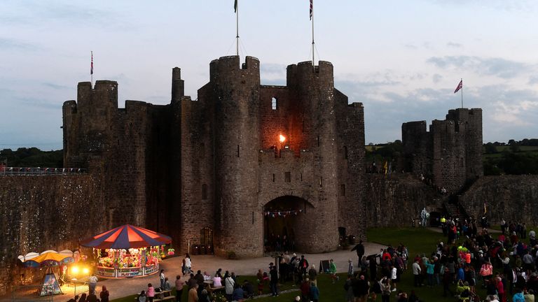 A Queen&#39;s Platinum Jubilee beacon is lit at Pembroke Castle, Pembrokeshire, Wales,
