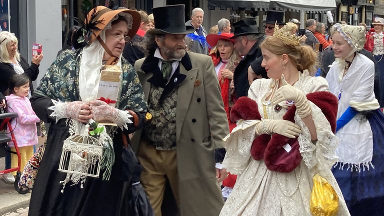 People dressed as Dickensian literary characters take part in parade at the Platinum Jubilee Dickens Festival in Rochester, Kent.
