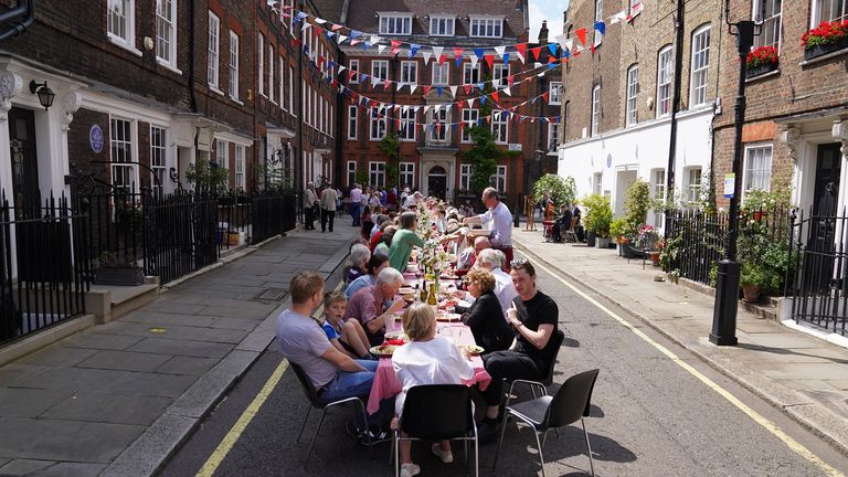 Residents eat lunch at a Platinum Jubilee street party in Westminster, central London, on day one of the Platinum Jubilee celebrations. Picture date: Thursday June 2, 2022.