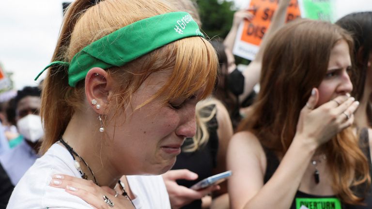 Abortion rights supporter Julianne D&#39;Eredita, 21, reacts as the US Supreme Court overturned Row v Wade