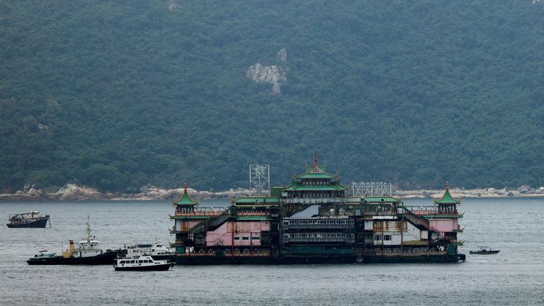 Closed iconic Jumbo Floating Restaurant sails away after the operator announced it would leave Hong Kong because of a lack of funds for maintenance, in Hong Kong, China, June 14, 2022. REUTERS/Tyrone Siu
