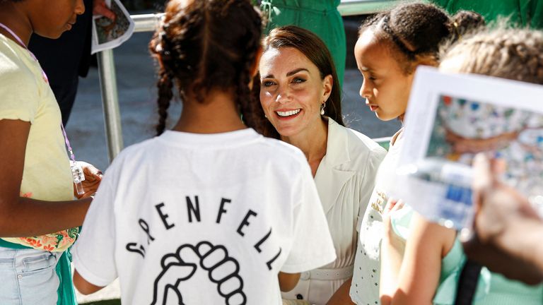 Catherine, Duchess of Cambridge, speaks with survivor and bereaved children during a memorial service to mark the fifth anniversary of the Grenfell Tower fire