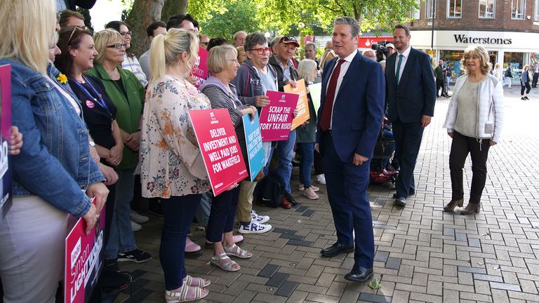 Labour leader Sir Keir Starmer talking to locals whilst on the Wakefield by-election campaign trail with Labour candidate Simon Lightwood (left) and local councillor Denise Jeffrey (right). Picture date: Monday June 13, 2022.