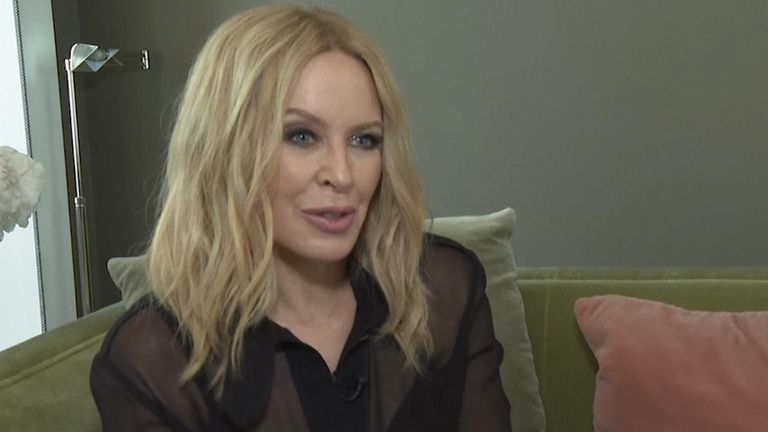 Kylie Minogue says returning to the set of 'Neighbors' was 'emotional'.  but 'great'.  Rice: AP