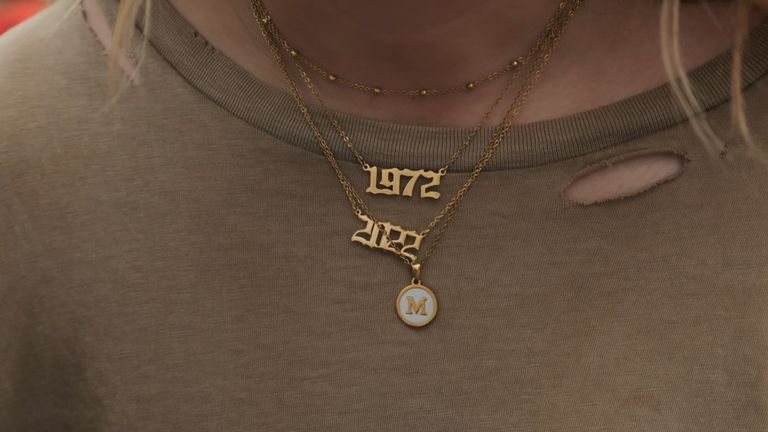 Macy Petty, a 20 -year-old pro-life student from Rock Hill, South Carolina, shows Joe Pike her necklace