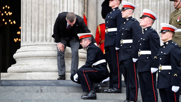 A member of the Ceremonial Guard suffers a medical issue outside of St Paul&#39;s Cathedral, on the day of the National Service of Thanksgiving, during Britain&#39;s Queen Elizabeth&#39;s Platinum Jubilee celebrations in London, Britain, June 3, 2022. REUTERS/Toby Melville/Pool
