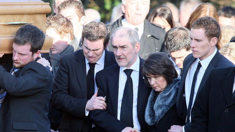Michaela&#39;s father Mickey Harte (centre) with other mourners at her funeral