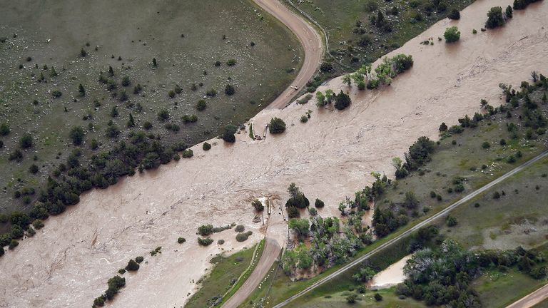 The bridge to Tom Miner Basin off of Highway 89 south of Livingston has been washed out as major flooding  washed away roads and set off mudslides in Yellowstone National Park in Montana on Monday. June 13, 2022. (Larry Mayer/The Billings Gazette via AP)