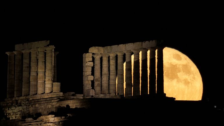 A full moon known as the "Strawberry Moon" rises behind the Temple of Poseidon, in Cape Sounion, near Athens, Greece June 14, 2022. REUTERS/Alkis Konstantinidis