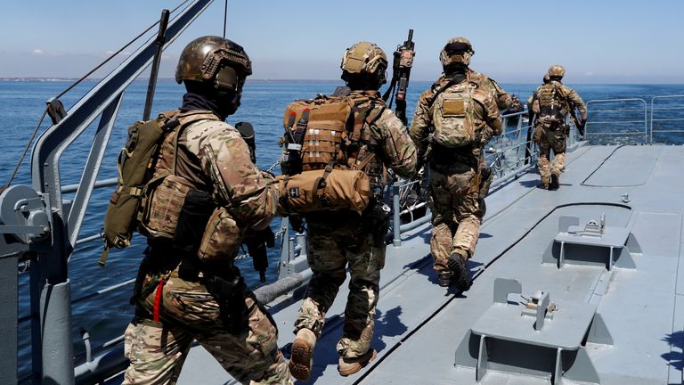 Soldiers walk on board the ship Vice Admiral Constantin Balescu 274 as Romanian, British and U.S. maritime NATO forces carry out &#39;Exercise Trojan Footprint in May