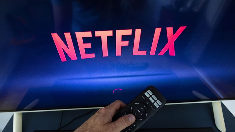 A Netflix logo is shown on a TV screen ahead of a Swiss vote on a referendum called "Lex Netflix" in this illustration taken May 9, 2022. Picture taken May 9, 2022. REUTERS/Denis Balibouse/Illustration
