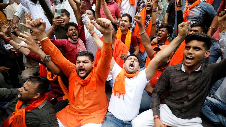 Activists of Bajrang Dal, a Hindu hardline group, shout slogans during a protest against the killing of a Hindu man in the city of Udaipur, a day after two Muslim men posted a video claiming responsibility for slaying him, in New Delhi, India, June 29, 2022. REUTERS/Amit Dave

