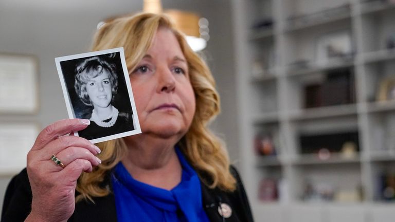 Nassau County District Attorney Anne Donnelly holds a photo of Diane Cusick during an interview with The Associated Press, Wednesday, June 22, 2022, in Mineola, N.Y. More than 50 years after a woman was found dead in her car at a mall on Long Island, authorities prosecutors are expected to announce that DNA evidence has linked the slaying to Richard Cottingham, a serial killer who has been connected to 11 murders in New York and New Jersey between 1965 and 1980. (AP Photo/Mary Altaffer)