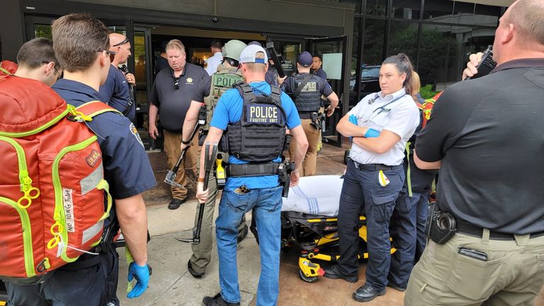 Emergency personnel work at the scene of a shooting at the Warren Clinic in Tulsa, Oklahoma, U.S., June 1, 2022. Tulsa Police/Handout via REUTERS ATTENTION EDITORS - THIS IMAGE HAS BEEN SUPPLIED BY A THIRD PARTY.
