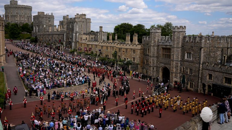 The procession walks to St George&#39;s Chapel for the Order of the Garter service at Windsor Castle 
Pic:AP