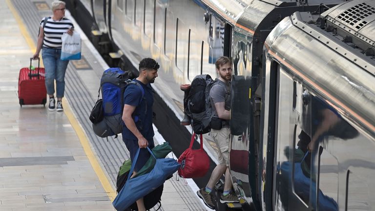 Passengers board a train bound for the west of England, ahead of a planned national strike by rail workers, at Paddington Station, in London, Britain, June 20, 2022. REUTERS/Toby Melville
