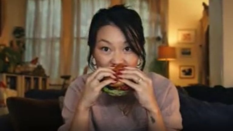 A screen grab taken from Tesco&#39;s Plant Chef burgers advert of a woman eating a Tesco burger has been banned over "misleading" claims that the products could make a positive difference to the environment compared with their meat equivalents. Issue date: Wednesday June 8, 2022.