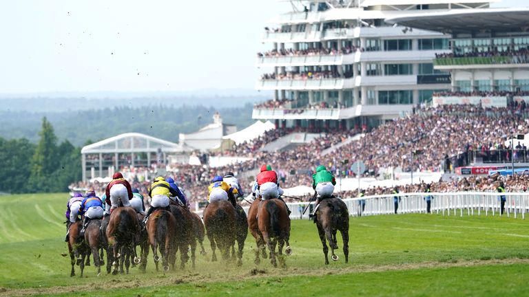 Runners and riders during the Cazoo Handicap on Derby Day during the Cazoo Derby Festival 2022 at Epsom Racecourse, Surrey. Picture date: Saturday June 4, 2022.
