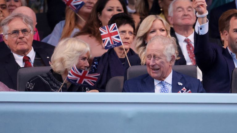 Prince Charles and Camilla, Duchess of Cornwall watch the Platinum Jubilee concert taking place in front of Buckingham Palace, London, Saturday June 4, 2022, on the third of four days of celebrations to mark the Platinum Jubilee. The events over a long holiday weekend in the U.K. are meant to celebrate Queen Elizabeth II&#39;s 70 years of service. (Chris Jackson/Pool via AP)