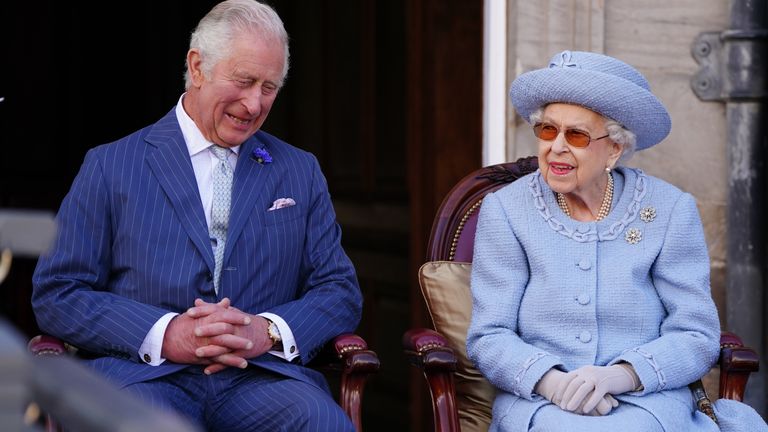 The Prince of Wales, known as the Duke of Rothesay when in Scotland and Queen Elizabeth II attending the Queen's Body Guard for Scotland (aka the Royal Company of Archers) Reddendo Parade in the gardens of the Palace of Holyroodhouse, Edinburgh .  Date photo: Thursday June 30, 2022.