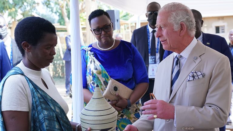 The Prince of Wales receives a gift basket as a gift during his visit to the reconciliation village of Mybo in Nyamata, as part of his visit to Rwanda.  Date taken: Wednesday, June 22, 2022.