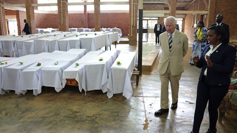 The Prince of Wales walks past coffins during his visit to the Nyamata Church Genocide Memorial, as part of his visit to Rwanda.  Date taken: Wednesday, June 22, 2022.
