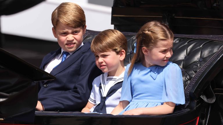 Prince George, Prince Louis and Princess Charlotte ride in a horse-drawn carriage as the Royal Procession leaves Buckingham Palace for a Colored Troop Ceremony at the Guards Parade, central London, as the Queen celebrates her birthday its official date, on one of the Platinum Jubilee celebrations.  Date taken: Thursday, June 2, 2022.