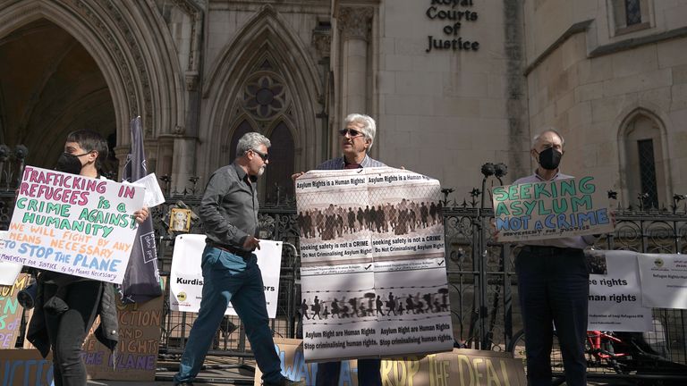 Protesters outside the High Court in London for the ruling on Rwanda deportation flights. Charities and campaigners supporting migrants are appealing against a High Court ruling on Friday which paved the way for the first deportation flight to take place on Tuesday. Picture date: Monday June 13, 2022.
