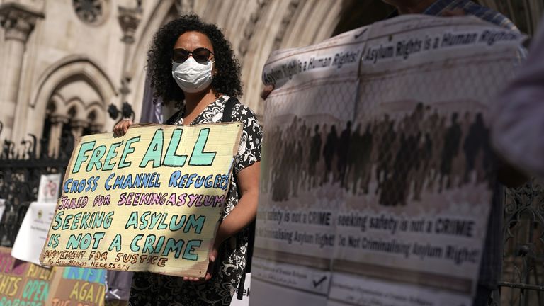 Protesters outside the High Court in London for the ruling on Rwanda deportation flights. Charities and campaigners supporting migrants are appealing against a High Court ruling on Friday which paved the way for the first deportation flight to take place on Tuesday. Picture date: Monday June 13, 2022.
