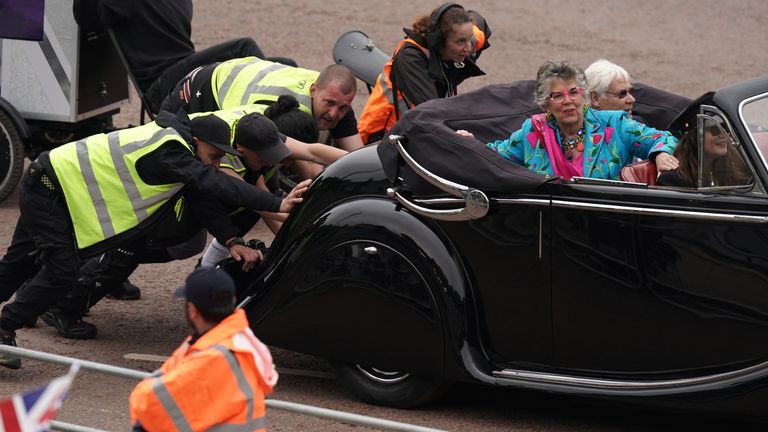 The car carrying Bake Off judge Prue Leith is pushed after it broke down during the Platinum Jubilee Pageant