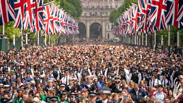 Crowds watch as Queen Elizabeth II makes an appearance on the balcony of Buckingham Palace, to view the Platinum Jubilee flypast, on day one of the Platinum Jubilee celebrations. Picture date: Thursday June 2, 2022.
