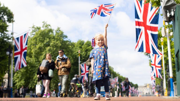 PARENTAL PERMISSION GIVEN Drew (surname not given), four, from Norwich, waves her Union flag on The Mall near Buckingham Palace, during a family day trip ahead of the Platinum Jubilee celebrations. Picture date: Wednesday June 1, 2022.
