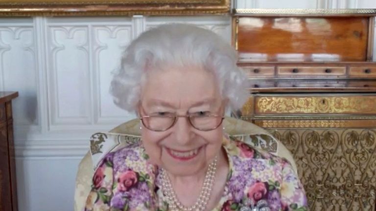 This undated handout video still issued Saturday, June 4, 2022 by Buckingham Palace shows Queen Elizabeth II on a video call with recipients of the Australian of the Year Awards which took place ahead of the Platinum Jubilee Central Weekend, in London. (Buckingham Palace via AP)