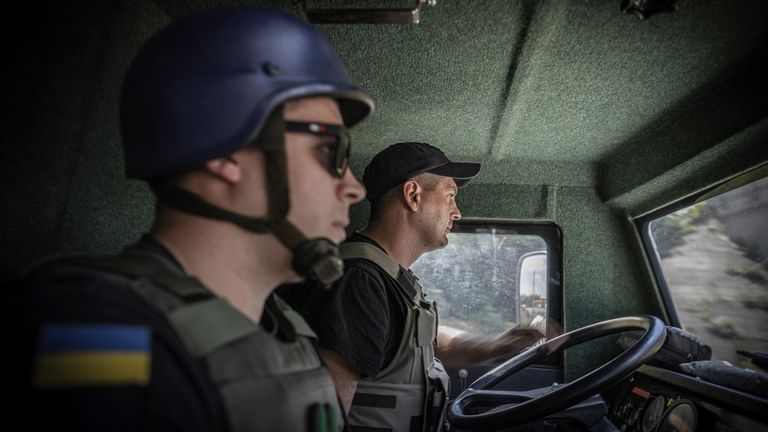 The evacuation team on the road in the cabin of the truck