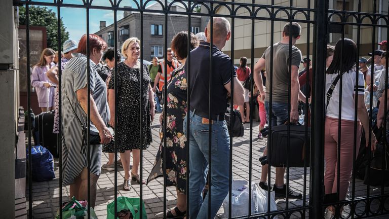 People arrive at a station in east Ukraine