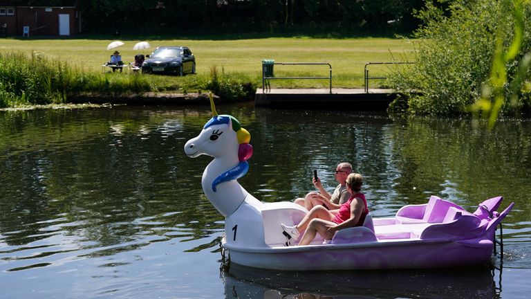 A couple travel along the river Avon on a pedal boat during warm weather in Warwick. Picture date: Wednesday June 15, 2022.
