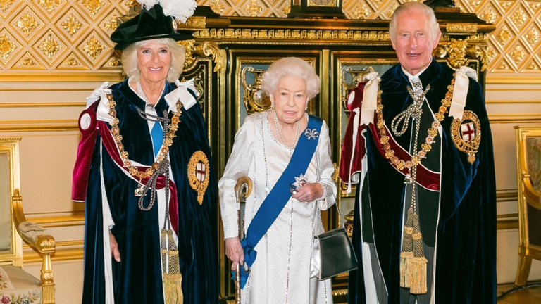 The Queen seen with walking stick as she is pictured with Prince Charles and Camilla to mark Order of the Garter service