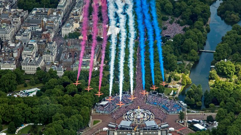 Red Arrows during a fly-by after Trooping the Color in London, Thursday, June 2, 2022, on the first of four days of celebrations to mark the Platinum Jubilee.  Events over a long weekend in the UK to celebrate the monarch's 70 years of service.  (RAF SAC Sarah Barsby, Department of Defense via AP)