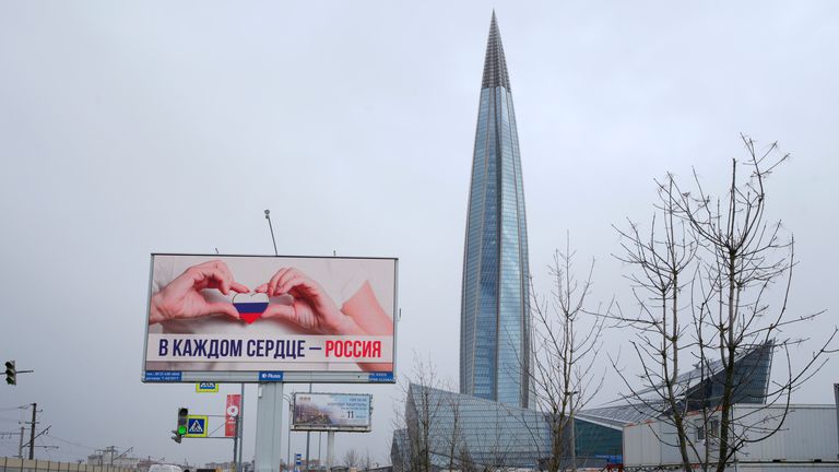 A view of the business tower Lakhta Centre, the headquarters of Russian gas monopoly Gazprom in St. Petersburg, Russia, Wednesday, April 27, 2022, with a poster reading &#39;Russia in every heart&#39; on the left. Polish and Bulgarian leaders have accused Russia of using gas supplies to blackmail their countries. The accusations come after the Russian energy Giant abruptly told them on Tuesday that it would cut off gas to the two European nations on Wednesday for refusing to pay for their supplies in ru