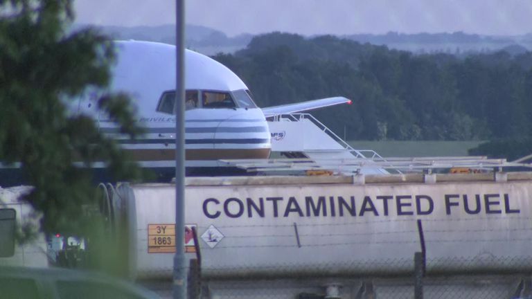 A Boeing 767-300 stands ready on a Ministry of Defense runway at Boscombe Down in Amesbury to take the first migrants to the east African country later this evening.