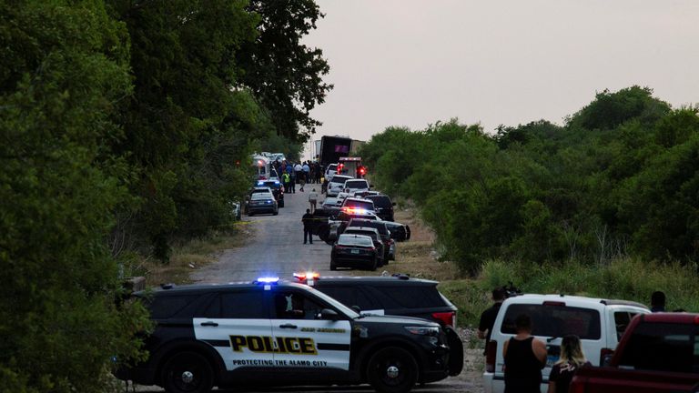 Law enforcement officers work at the scene where people were found dead inside a trailer truck in San Antonio, Texas, U.S. June 27, 2022. REUTERS/Kaylee Greenlee Beal
