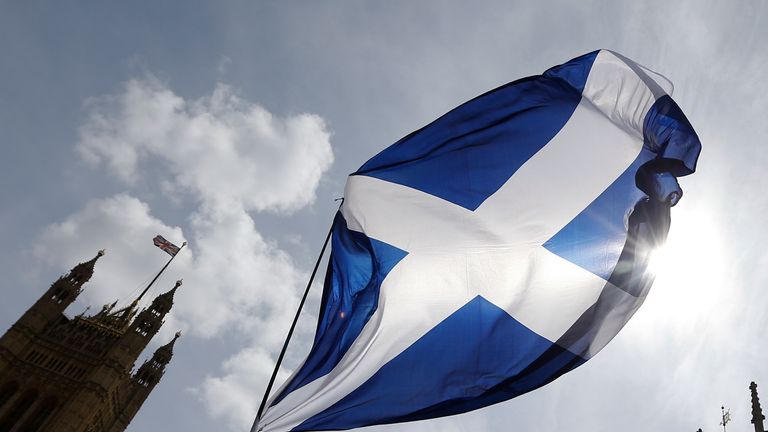 A representation of the Scottish flag flies above Parliament in Westminster