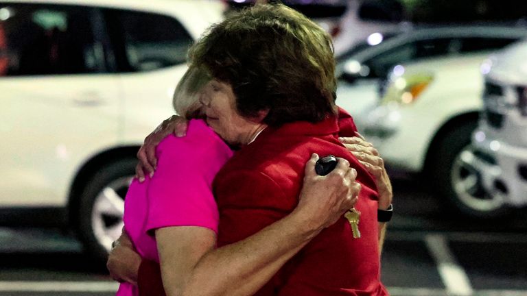 Church members console each other after a shooting at the Saint Stephen...s Episcopal Church on Thursday, June 16, 2022 in Vestavia, Ala. (AP Photo/Butch Dill)