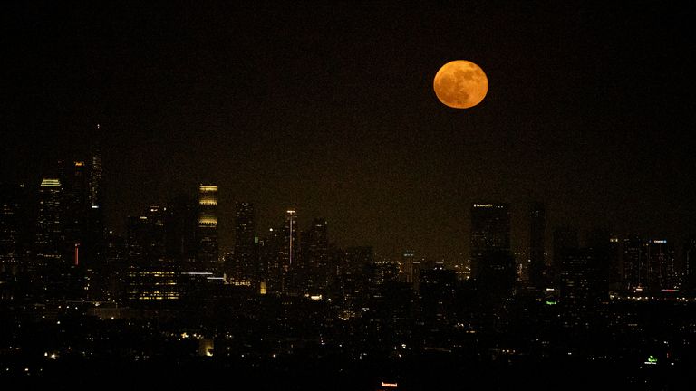 A supermoon rises above the skyline of downtown Los Angeles, Tuesday, June 14, 2022. The moon reached its full stage on Tuesday, during a phenomenon known as a supermoon because of its proximity to Earth, and it is also labeled as the "Strawberry Moon" because it is the full moon at strawberry harvest time. (AP Photo/Ringo H.W. Chiu)
PIC:AP