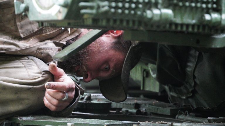 Andrii Koval inspects a tank
